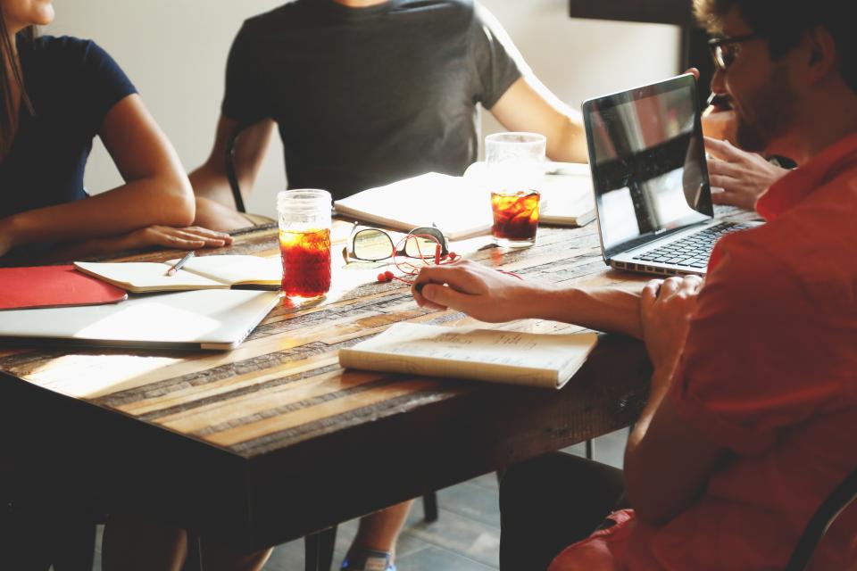 An owner talking through goals at a table